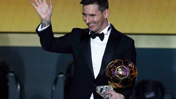 Messi of Argentina holds the World Player of the Year award during the FIFA Ballon d'Or 2015 ceremony in Zurich.
