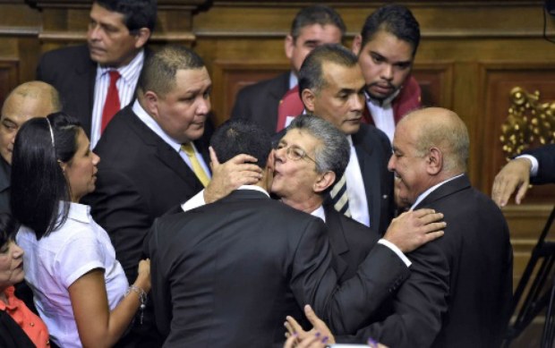 National Assembly President Henry Ramos Allup embraces fellow MUD legislators in parliament.