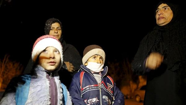 Residents who say they have been allowed to leave the besieged town, depart after an aid convoy entered Madaya, Syria,  Jan. 11, 2016.