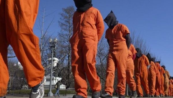 Members of the group Witness Against Torture protest the Guantanamo Bay Prison.