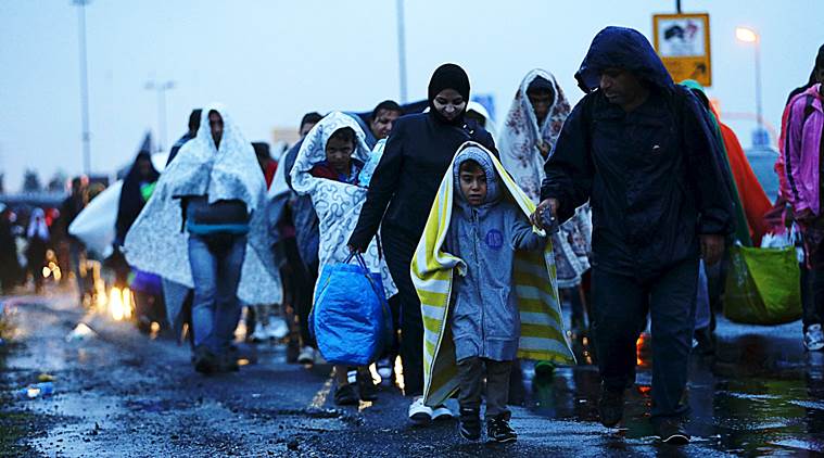 Migrants arrive at the Austrian-Hungarian border station of Hegyeshalom, Hungary, Sept. 5, 2015.