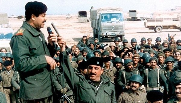 Iraqi leader Saddam Hussein addresses his troops in 1990.