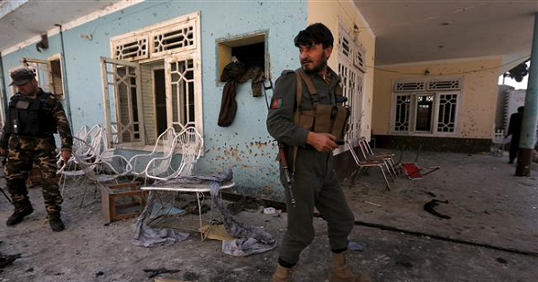 Afghan security forces inspect the site of a bomb attack in Jalalabad, eastern Afghanistan, on Jan. 17, 2016
