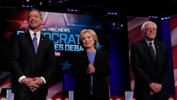 Democrat U.S. presidential candidates (L-R) Martin O'Malley, Hillary Clinton and Bernie Sanders pose together.
