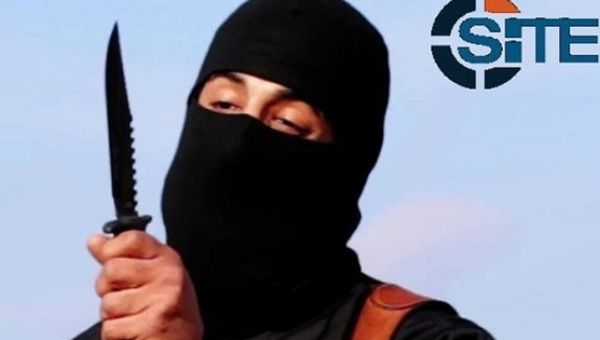 A masked, black-clad militant,  identified by the Washington Post newspaper as Mohammed Emwazi, brandishes a knife in this still image from a 2014 video. 