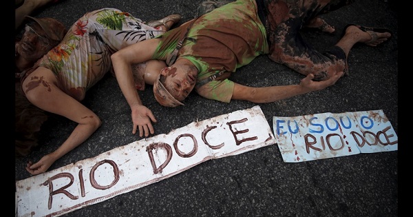 Activists stage a die-in to protest contamination of Brazil's Doce River by a mining tailings pond dam breach at the Samarco iron ore mine.