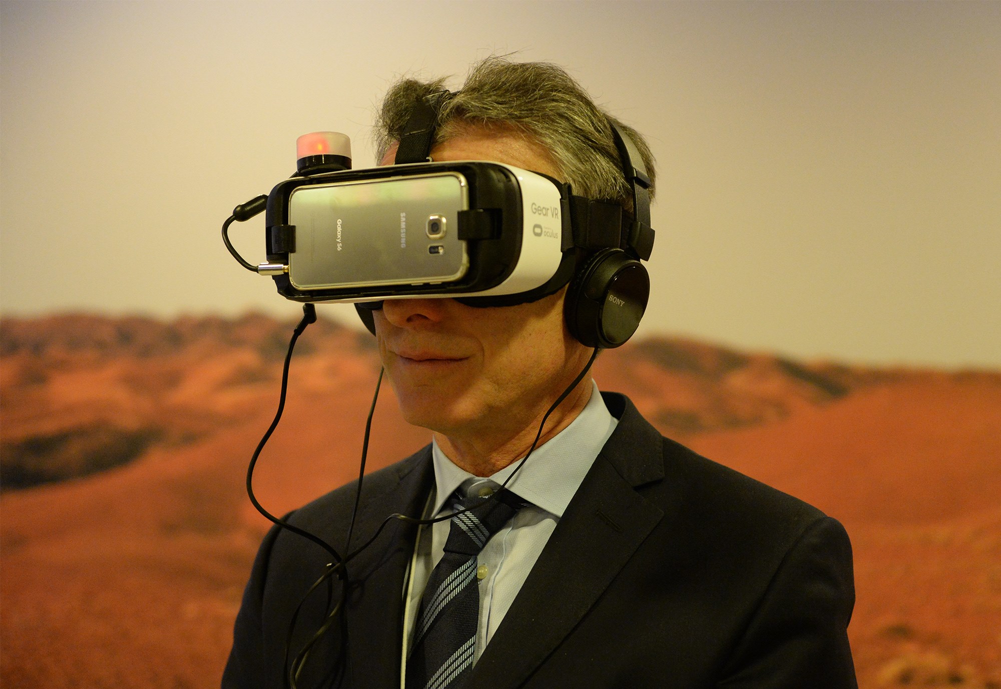 Macri tests out virtual reality headgear in Davos, Switzerland.