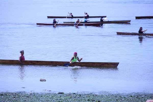 Lummi women take part in canoe races.