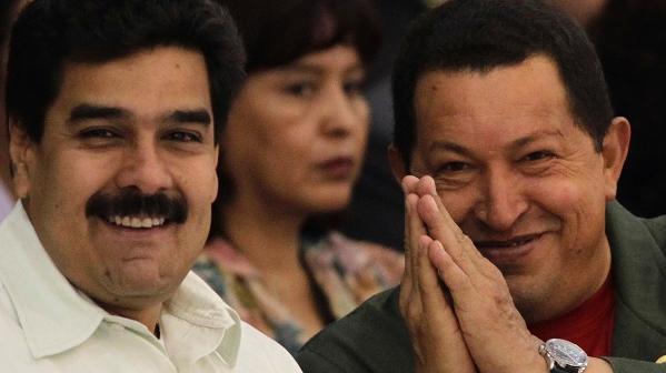 Venezuela's President Hugo Chavez (R) gestures next to Nicolas Maduro. Both Venezuelan presidents have been targets of dishonest and hostile reporting Western media outlets.