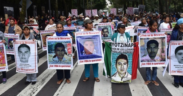 Ayotzinapa students and supporters lead a demonstration on Sept. 26, 2015 in Mexico City to commemorate one year since their disappearance.