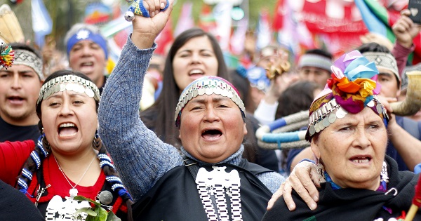 Mapuche women take part in a resistance march in Santiago, Chile Oct. 12, 2015.