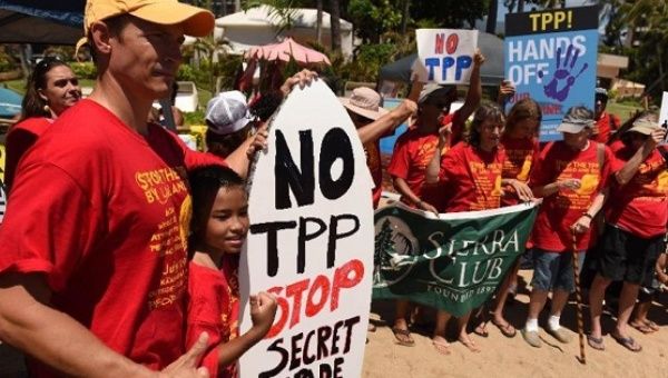 People protest the Trans Pacific Partnership in Maui, Hawaii, July 29, 2015.