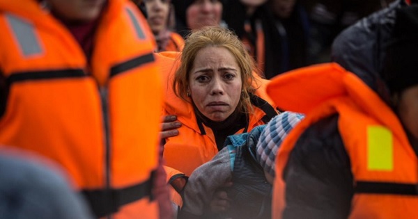 A distraught woman is rescued by the coast guard in the Aegean Sea, near Turkey's western coast.