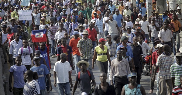 Protesters march during a demonstration against the electoral process in Port-au-Prince, Haiti.