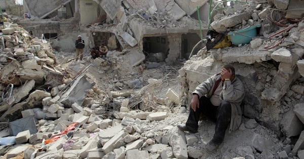 A man at a site recently hit by what activists said was a Scud missile in Aleppo’s Ard al-Hamra neighborhood in Syria.