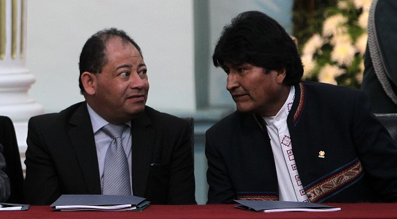 Bolivia's President Evo Morales (R) consults with Interior Minister Carlos Romero in this file photo, Aug. 15, 2015.