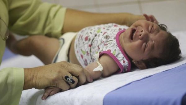 Hospital staff Oswaldo Cruz prepares to draw blood from baby Lorrany Emily da Silva, who has microcephaly, at the Oswaldo Cruz Hospital in Recife, Brazil, Jan. 26, 2016. 