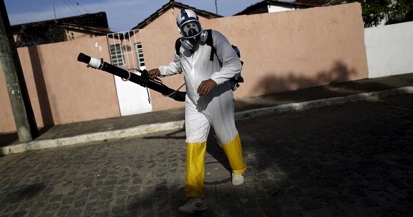 A municipal worker sprays insecticide at the neighborhood of Afogados in Recife, Brazil, Feb. 2, 2016.