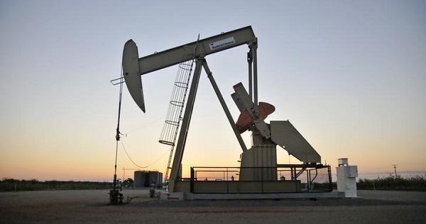 A pump jack operates at a well site leased by Devon Energy Production Company near Guthrie, Oklahoma.