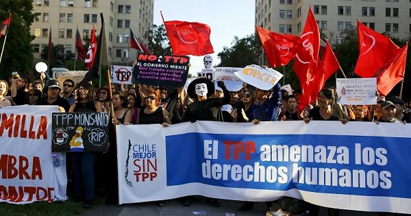 Demonstrators protest against the Trans-Pacific Partnership in front of the government house in Santiago, Chile, Feb. 4, 2016.