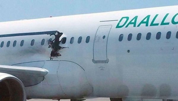A suicide bomber was sucked out of the hole on the side of the plane after committing suicide.