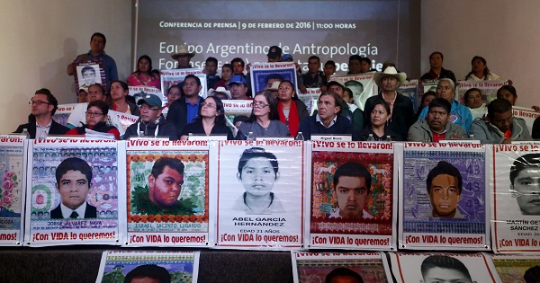 Members of the EAAF and relatives of the 43 missing Ayotzinapa students take part in a news conference in Mexico City, Feb. 9, 2016.