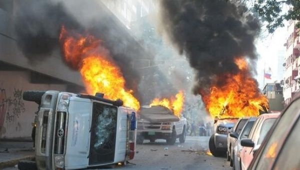 Burning cars in Venezuela in 2014