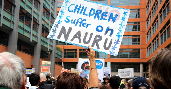 Activists hold placards and chant slogans as they protest outside the offices of the Australian Immigration Department in Sydney, Australia, in this file picture.