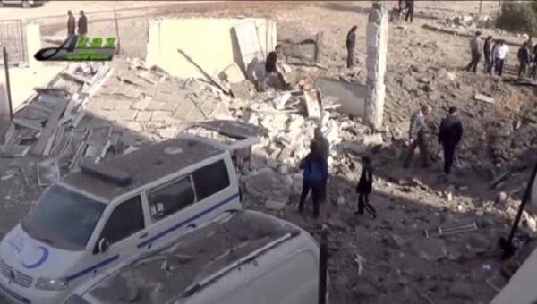 People gather near what is said to be a hospital damaged by missile attacks in Azaz, Aleppo, Syria, February 15, 2016 in this still image taken from a video on a social media website. 