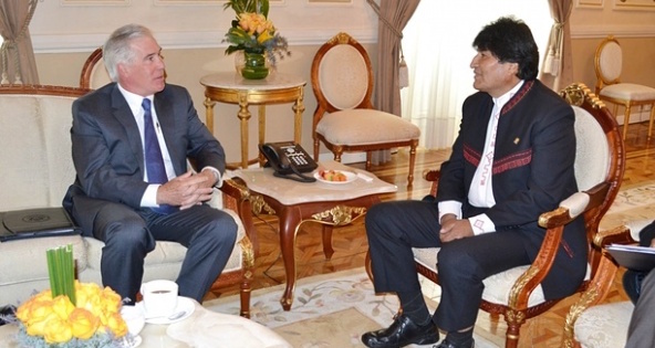 Bolivia’s President Evo Morales (right) talks with the Charge d’Affaires of the United States, Peter Brennan, during a meeting at the presidential palace in La Paz.