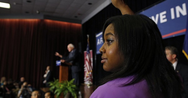 Erica Garner, daughter of Eric Garner, raises her hand to ask Sanders a question at a campaign event in Columbia, S.C., Feb. 16, 2016.