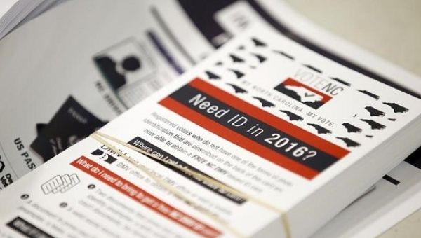 Flyers informing voters of the new voter ID law that will go into effect for the 2016 election, in Charlotte, North Carolina.