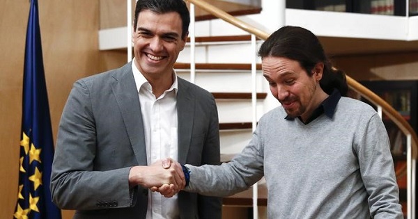 PSOE leader Pedro Sanchez and Podemos leader Pablo Iglesias shake hands before their meeting at the Spanish Parliament in Madrid, Spain, Feb. 5, 2016.