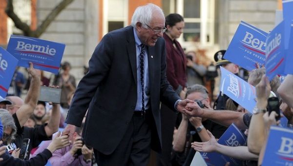 Senator Bernie Sanders greets supporters at a campaign rally outside the New Hampshire State House on Nov. 5, 2015. 