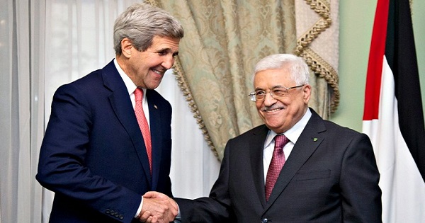 U.S. Secretary of State John Kerry shakes hands with Palestinian Authority President Mahmoud Abbas.