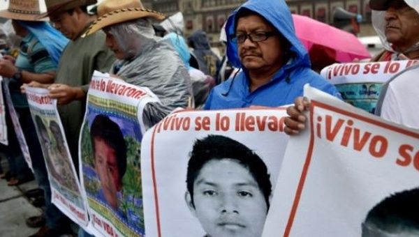 Families of the 43 disappeared Ayotzinapa students demonstrate in Mexico City on Sept. 26, 2015, one year after their relatives were disappeared.