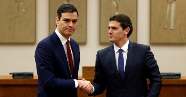 Socialists' (PSOE) party leader Pedro Sanchez (L) and Ciudadanos party leader Albert Rivera shake hands after signing an agreement in Madrid, Spain.