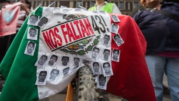 Demonstrators mark 17 months since the disappearance of the 43 Ayotzinapa students, Feb. 26, 2016.