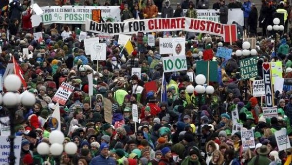 Protesters take part in a rally ahead of the COP21 Paris climate summit on Parliament Hill in Ottawa, Canada, Nov. 29, 2016.