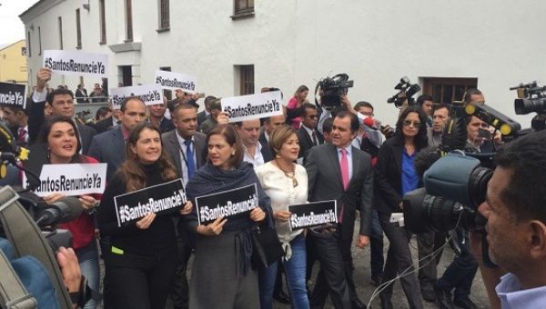 Politicians from the far-right Democratic Center march through the streets of Bogota and call on President Santos to resign, March 1, 2016.