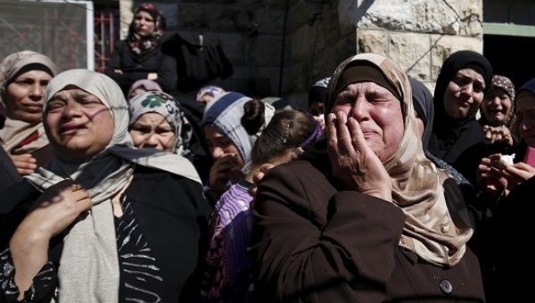 Relatives mourn during the funeral of 22-year-old Palestinian man Eyad Sajedeya, who medics said was shot dead by Israeli forces, in Ramallah.