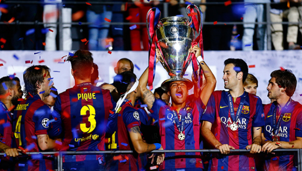 Barcelona's Rafinha celebrates with the trophy after winning the UEFA Champions League Final in Berlin Jun. 6, 2015