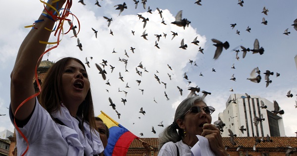 Demonstrators march for peace in Cali, Colombia, Dec. 13, 2014.