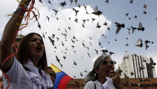 Demonstrators march for peace in Cali, Colombia, Dec. 13, 2014.