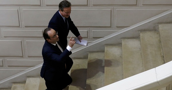 French President Francois Hollande and Britain's Prime Minister David Cameron arrive to attend a joint news conference during a Franco-British summit in Amiens.