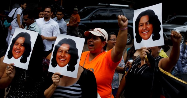 Protesters demonstrate with photos of murdered Indigenous leader Berta Caceres in Tegucigalpa, Honduras, March 3, 2016.