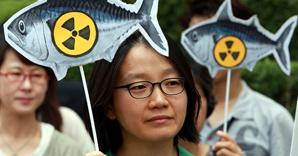 Environmental activists protest the environmental destruction of Fukushima outside the Japanese Embassy in Seoul, South Korea.