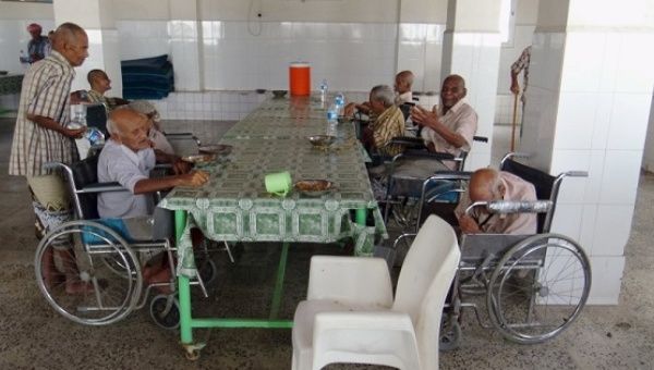 Elderly residents of a home sit in the dining hall after it was attacked by gunmen in the Yemeni port town of Aden March 4, 2016.