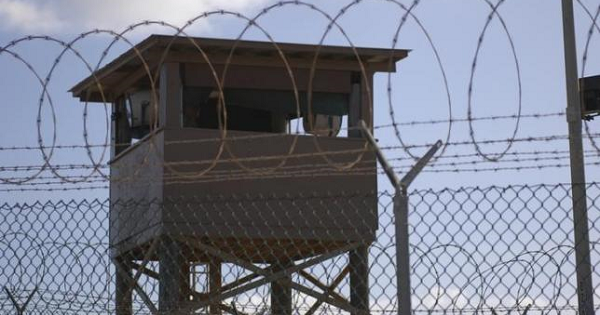 A soldier stands guard in a tower overlooking Camp Delta at Guantanamo Bay naval base in a Dec. 31, 2009 file photo provided by the US Navy.