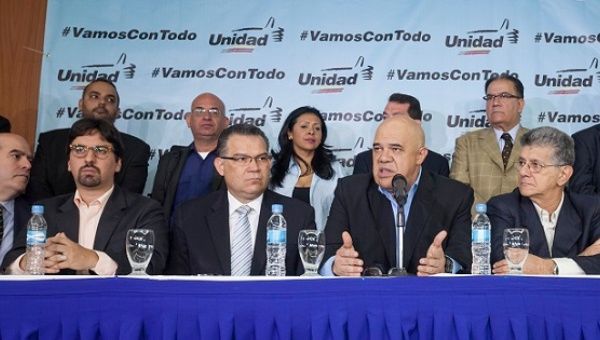 MUD Secretary-General Jesus Torrealba (2ndR) speaks during a press conference in Caracas, Venezuela, flanked by senior MUD figures, March 8, 2016.